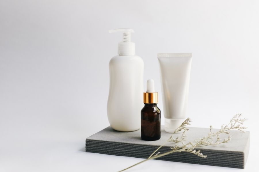 Minimalist skincare products representing K-Beauty vs Western Cosmetics philosophy with clean packaging design