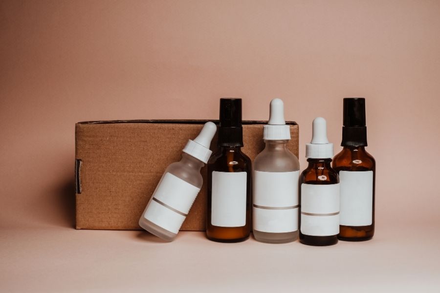 Collection of peptide serums in amber and clear bottles with minimalist packaging