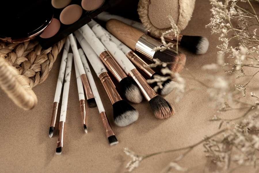 Professional makeup brushes and color correcting palette for expert makeup application