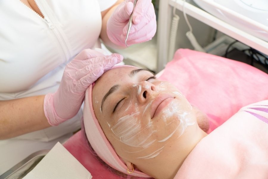 Professional double cleansing facial treatment being performed at medical spa