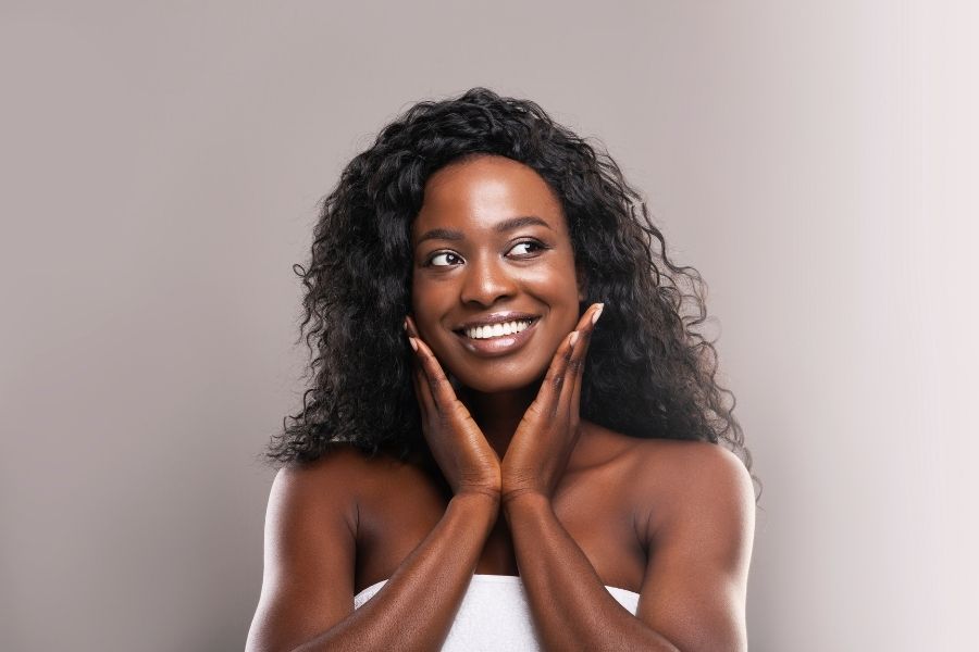 Beautiful woman with natural makeup showcasing subtle underpainting technique results